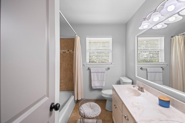 full bath featuring shower / bath combination with curtain, vanity, tile patterned floors, baseboards, and toilet