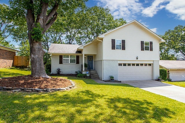 split level home featuring concrete driveway, brick siding, an attached garage, and fence