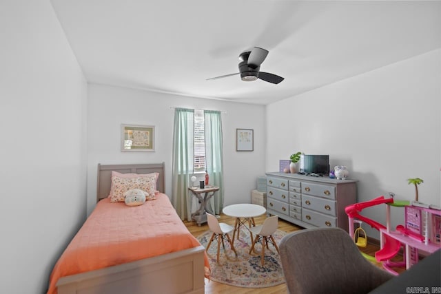 bedroom with ceiling fan and light wood finished floors
