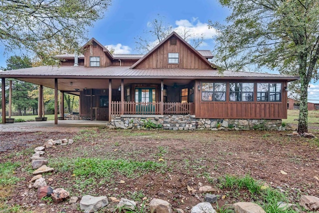 190 Polk Road 624, Mena, AR 71953 - view of front of home with a porch, board and batten siding, metal roof, and a carport