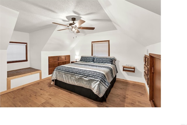 190 Polk Road 624, Mena, AR 71953 - bedroom featuring baseboards, ceiling fan, wood finished floors, and lofted ceiling