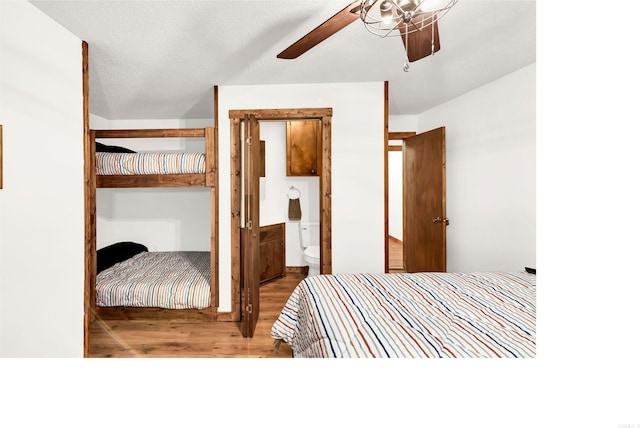 190 Polk Road 624, Mena, AR 71953 - bedroom featuring ceiling fan, wood finished floors, and ensuite bath