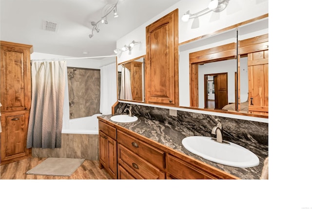 190 Polk Road 624, Mena, AR 71953 - bathroom featuring visible vents, a sink, tiled shower / bath, and double vanity