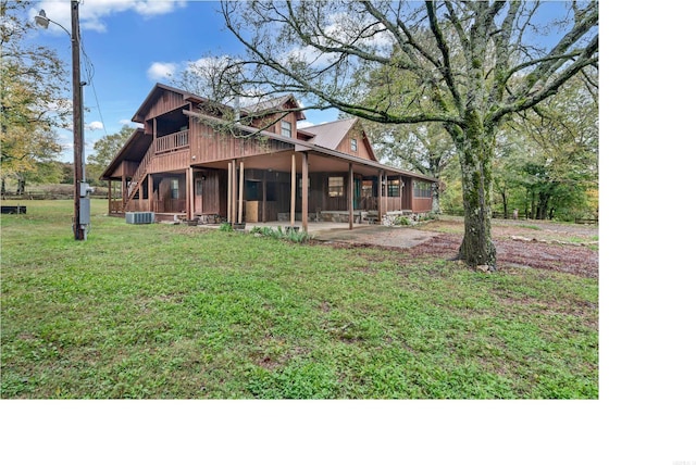 190 Polk Road 624, Mena, AR 71953 - rear view of house with a lawn, a patio, and central AC unit