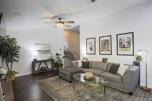 living area featuring a ceiling fan, stairway, baseboards, lofted ceiling, and hardwood / wood-style floors