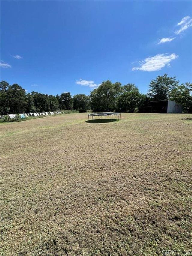 view of yard with a trampoline