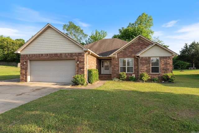 view of front of home with brick siding, a garage, a front lawn, and concrete driveway