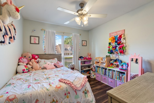 bedroom featuring a ceiling fan and dark wood finished floors