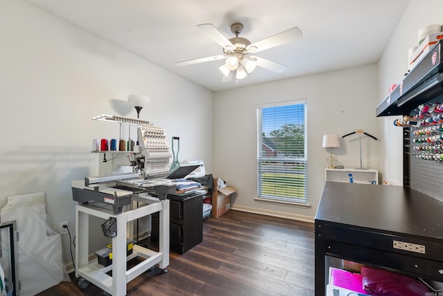 office space with baseboards, ceiling fan, and wood finished floors