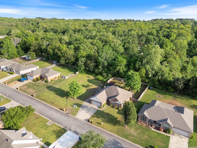 drone / aerial view with a residential view and a forest view