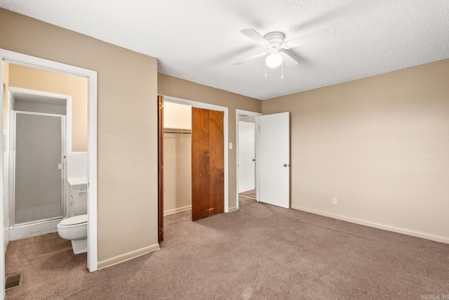 unfurnished bedroom with a closet, visible vents, baseboards, connected bathroom, and carpet flooring