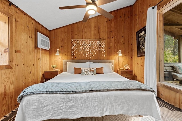 bedroom featuring an AC wall unit, a ceiling fan, wood walls, and vaulted ceiling