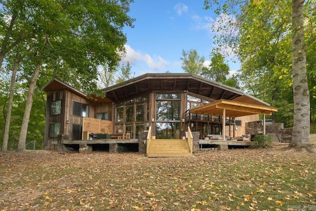 back of house with a sunroom