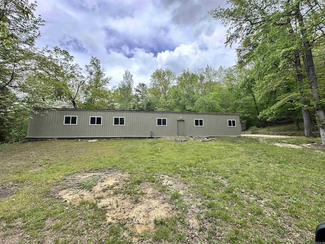rear view of house with a yard
