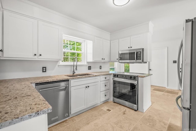 2300 Old Forge Dr, Little Rock, AR 72227 - kitchen featuring white cabinets, light stone countertops, appliances with stainless steel finishes, a sink, and visible vents