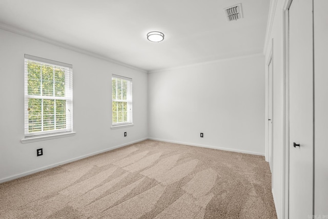 2300 Old Forge Dr, Little Rock, AR 72227 - carpeted empty room featuring crown molding, baseboards, a wealth of natural light, and visible vents