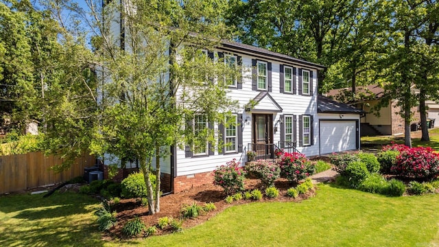 2300 Old Forge Dr, Little Rock, AR 72227 - colonial-style house featuring fence and a front lawn