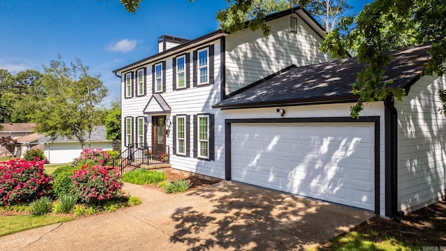2300 Old Forge Dr, Little Rock, AR 72227 - colonial inspired home with a garage, a shingled roof, a chimney, and driveway