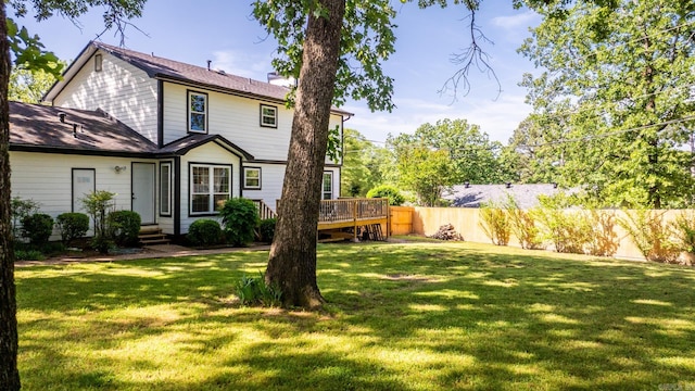 2300 Old Forge Dr, Little Rock, AR 72227 - rear view of house featuring a lawn, a chimney, fence, and a deck