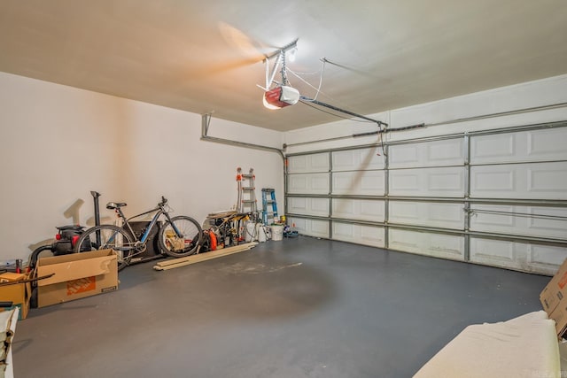 2300 Old Forge Dr, Little Rock, AR 72227 - garage featuring a garage door opener