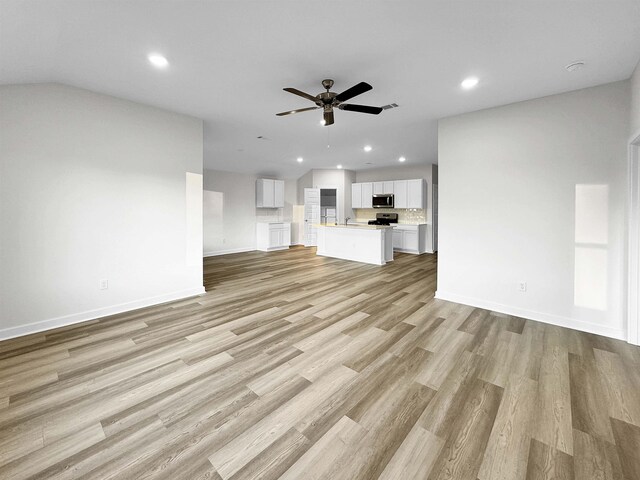 3625 Wise Rd, Bryant, AR 72002 - unfurnished living room with recessed lighting, a ceiling fan, baseboards, and light wood finished floors