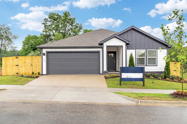3715 Wise Rd, Bryant, AR 72002 - view of front of property with a garage, a front lawn, fence, board and batten siding, and concrete driveway