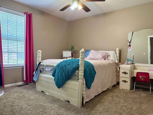 bedroom with baseboards, a ceiling fan, and carpet flooring