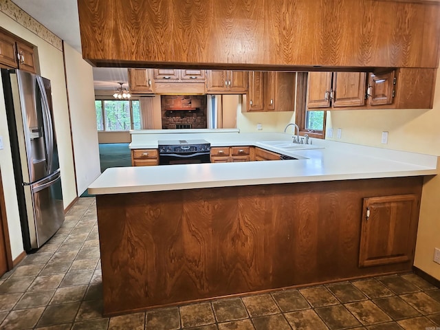 50 Monovar Cir, Hot Springs Village, AR 71909 - kitchen with stainless steel fridge, a sink, electric stove, a peninsula, and light countertops