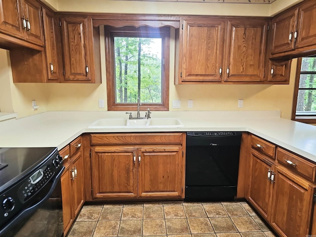 50 Monovar Cir, Hot Springs Village, AR 71909 - kitchen with black appliances, a sink, light countertops, and brown cabinetry