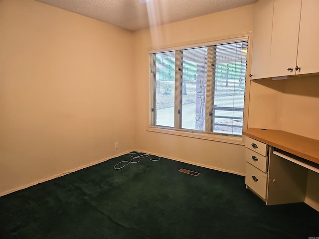 50 Monovar Cir, Hot Springs Village, AR 71909 - unfurnished office featuring dark colored carpet, plenty of natural light, and baseboards