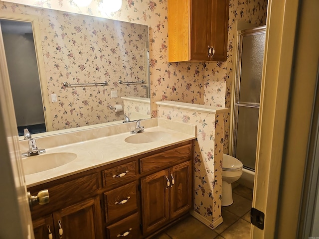 50 Monovar Cir, Hot Springs Village, AR 71909 - full bath featuring wallpapered walls, toilet, a shower with door, double vanity, and tile patterned flooring