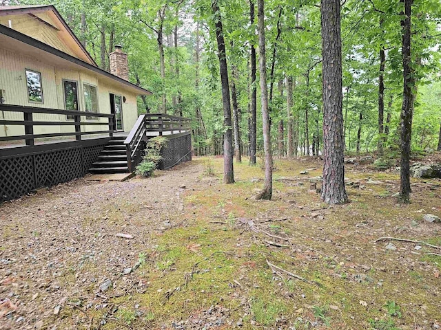 50 Monovar Cir, Hot Springs Village, AR 71909 - view of yard with a deck and a wooded view
