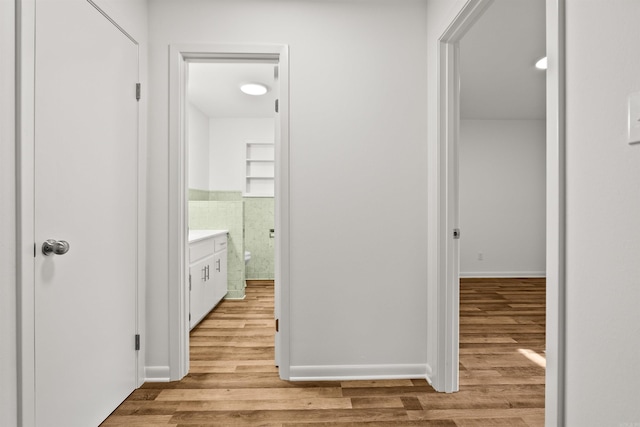 hallway featuring wood finished floors