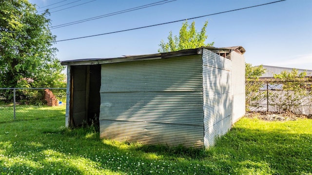 view of outbuilding with an outdoor structure and fence