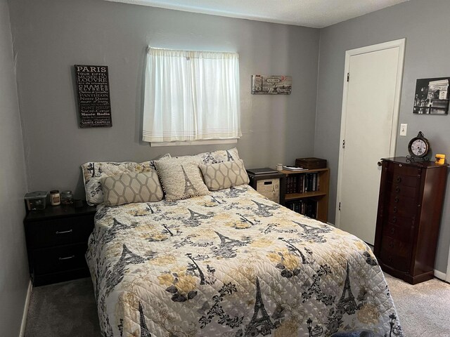 bedroom with baseboards and carpet flooring