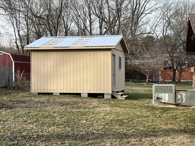 view of shed with fence