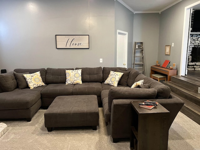 living room with ornamental molding and light colored carpet