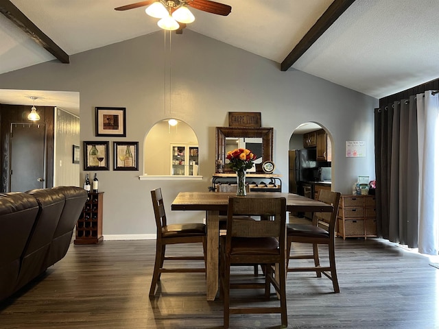 dining room with vaulted ceiling with beams, a ceiling fan, baseboards, and dark wood-type flooring