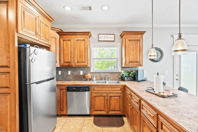 kitchen with visible vents, light countertops, a sink, appliances with stainless steel finishes, and light tile patterned floors
