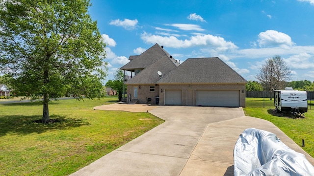 view of front facade with fence, a shingled roof, a front lawn, a garage, and concrete driveway