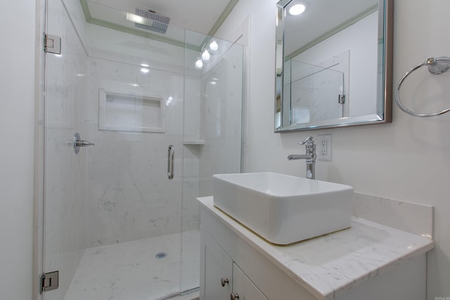 full bath featuring vanity, visible vents, and a stall shower