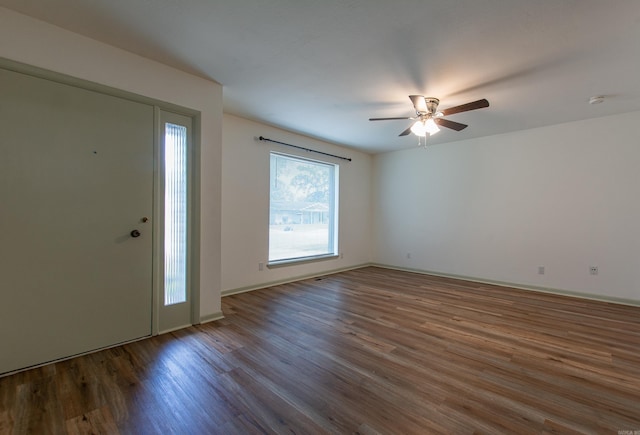 entryway with baseboards, ceiling fan, and wood finished floors