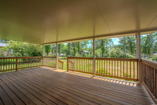 wooden terrace with a yard