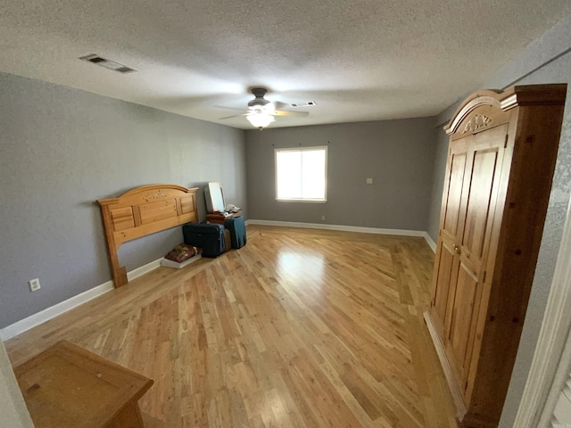 1101 S 8th St, Heber Springs, AR 72543 - interior space with a textured ceiling, visible vents, baseboards, and light wood-style floors