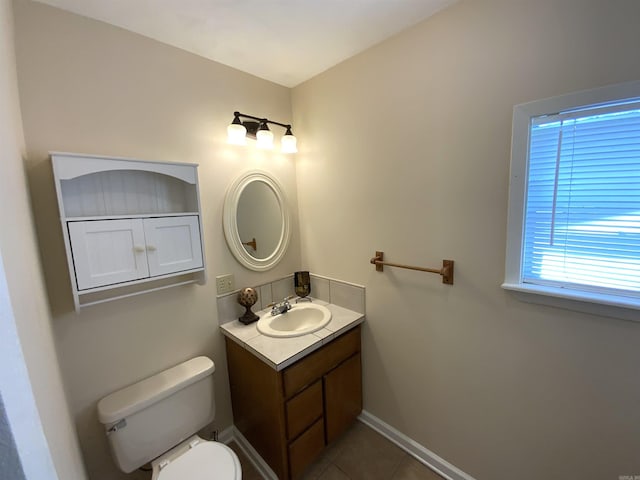 1101 S 8th St, Heber Springs, AR 72543 - bathroom with baseboards, tile patterned floors, vanity, and toilet