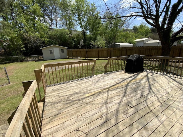 1101 S 8th St, Heber Springs, AR 72543 - wooden terrace with an outdoor structure, a fenced backyard, and a lawn