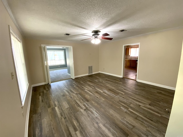 1101 S 8th St, Heber Springs, AR 72543 - unfurnished room featuring ceiling fan, dark wood-style flooring, a textured ceiling, and visible vents