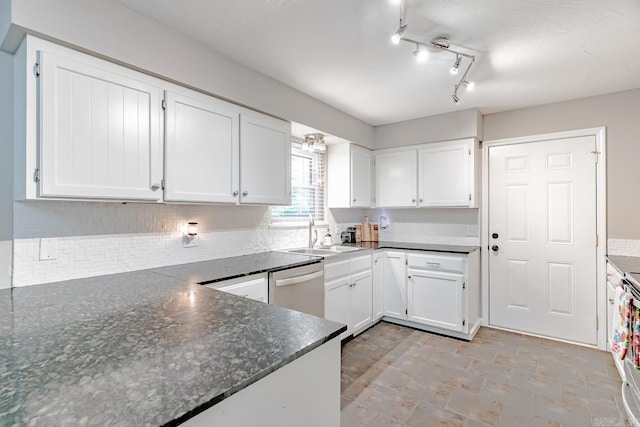 1321 W Front St, Heber Springs, AR 72543 - kitchen with backsplash, dishwasher, a sink, white cabinets, and dark stone countertops