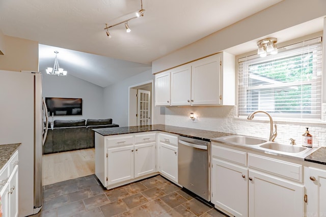 1321 W Front St, Heber Springs, AR 72543 - kitchen featuring white cabinets, a sink, dishwasher, freestanding refrigerator, and a peninsula