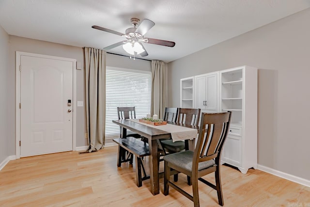 1321 W Front St, Heber Springs, AR 72543 - dining space featuring ceiling fan, baseboards, and light wood finished floors
